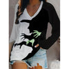 Maglia nera da donna con scollo a V e grafica da strega per Halloween