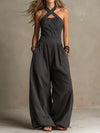 SLOWE ™ | Designer jumpsuit with crossover neckline